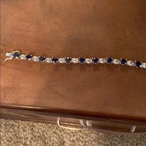 Blue gem and sterling silver tennis bracelet